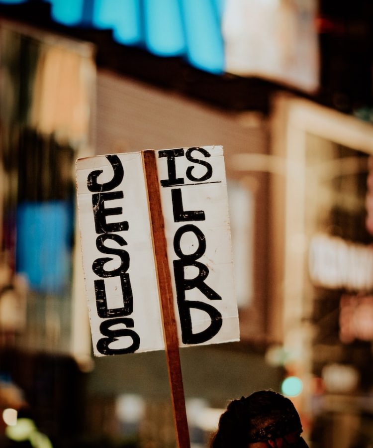 Photo by Jon Tyson white and black wooden signage